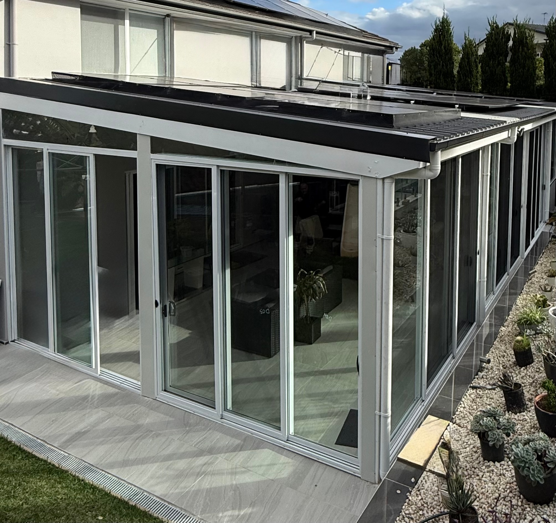 Alfresco enclosure — wrap-around glazing
